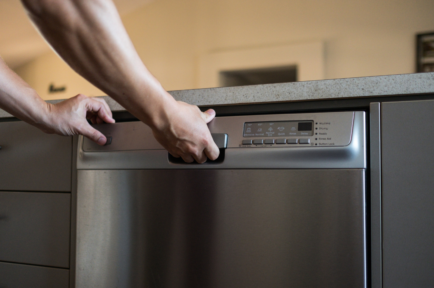 Person opening dishwasher